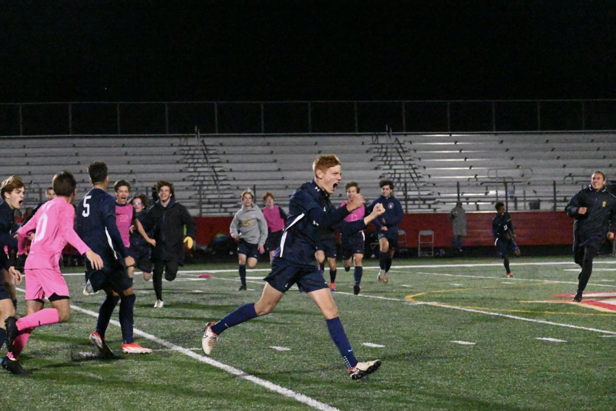 CHAMPIONSHIP CELEBRATION. Ninth-grader Graham Waibel celebrates as the clock hits zero and the Spartans are officially declared Section 3A champions with their 1-0 win. After losing to Minnehaha during the regular season, beating their conference rival to advance to the state tournament felt like even more of a victory for BVS.