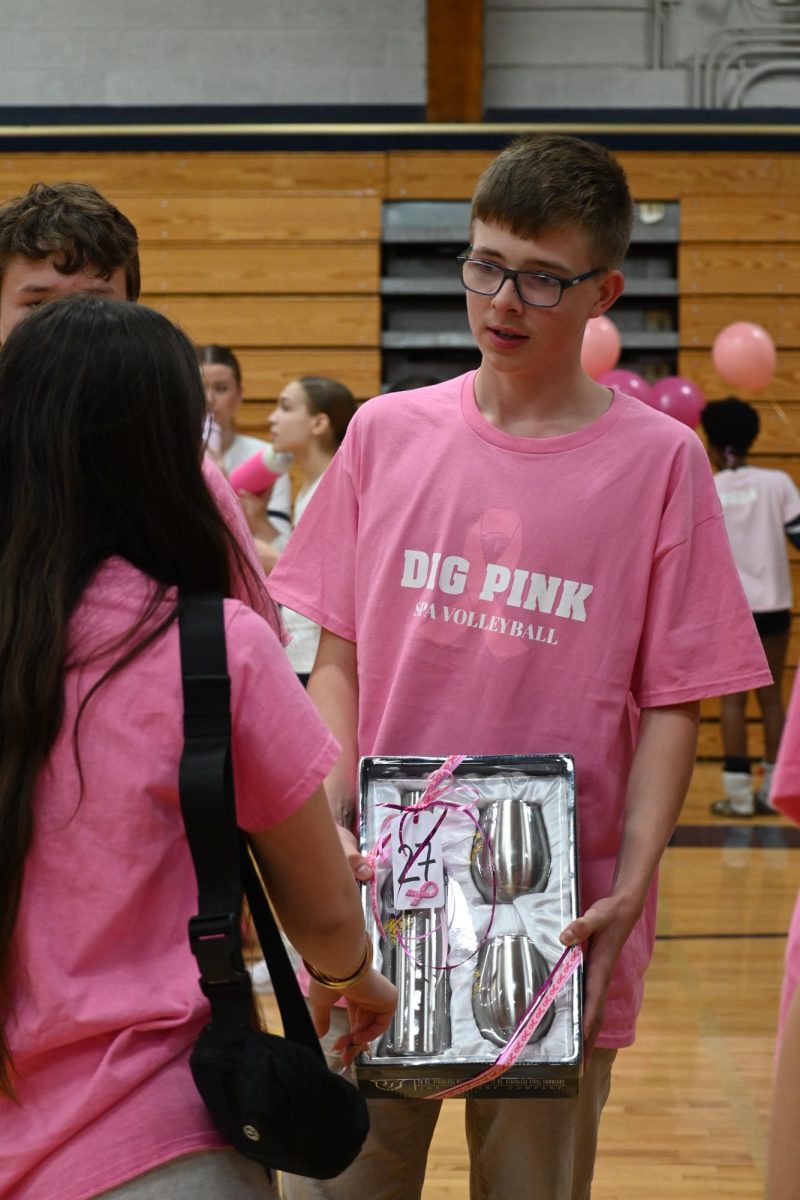 EYE ON THE PRIZE. German exchange student Eric walked home with the perfect souvenir from the raffle: a Vikings branded cocktail shaker set. 