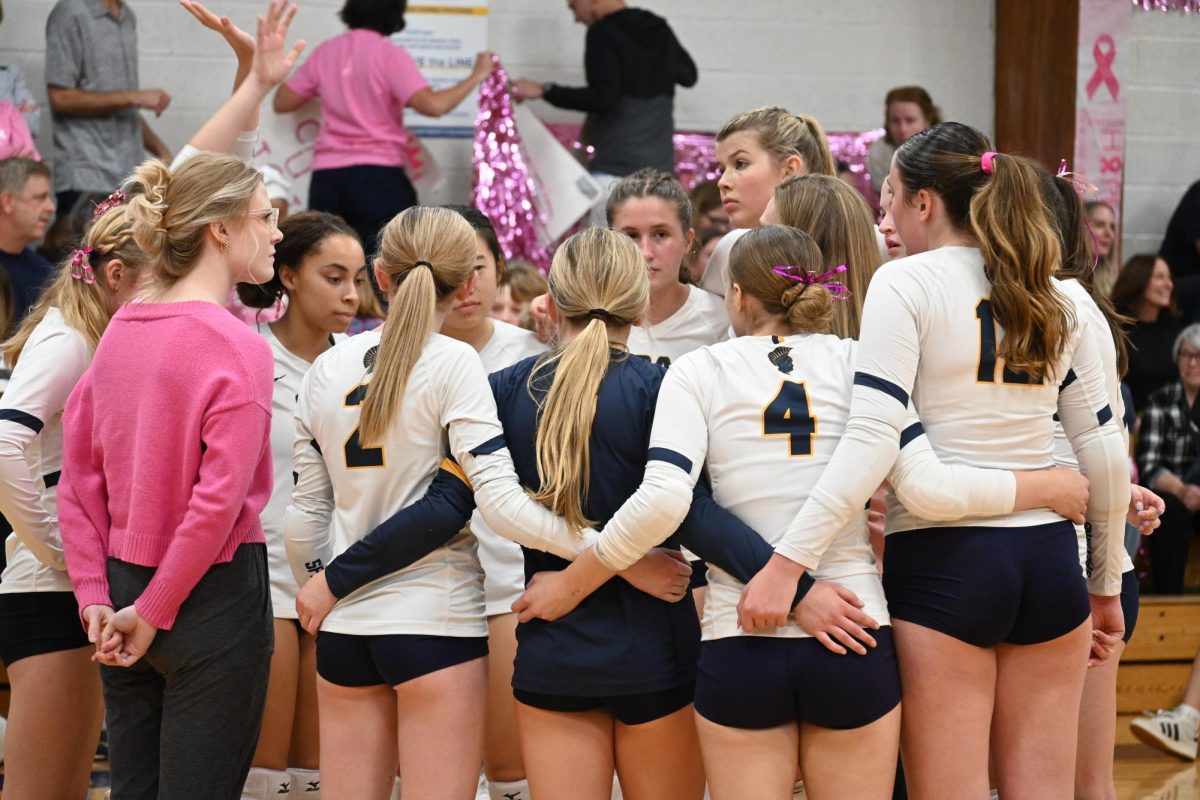 POST-GAME HUDDLE. After winning, the team huddled up and recounted game highlights and lowlights.