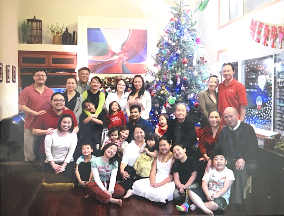 FAMILY FIRST.  Reuniting during the holiday season, senior Serene Kalugdan’s extended family gather around a Christmas tree for a photo. 