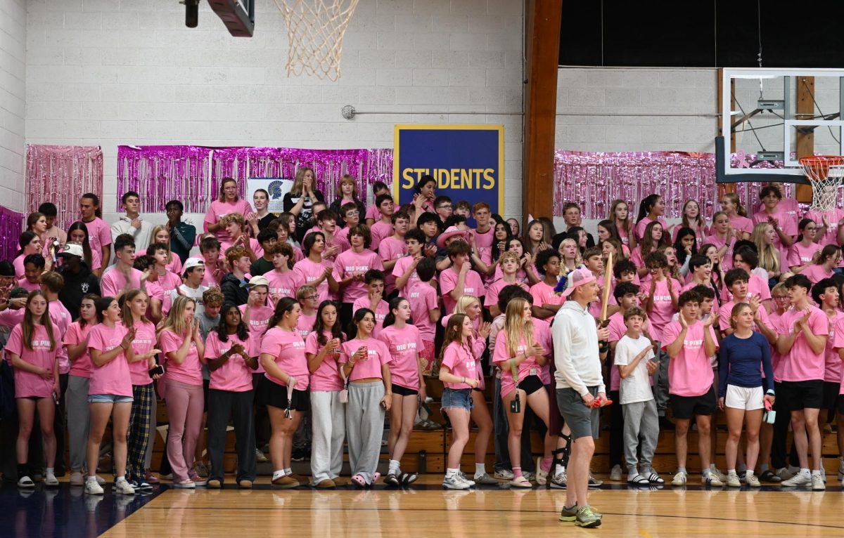 SEA OF PINK. The united student section put up an intimidating face as they flaunted their 2024 Dig Pink merch. 