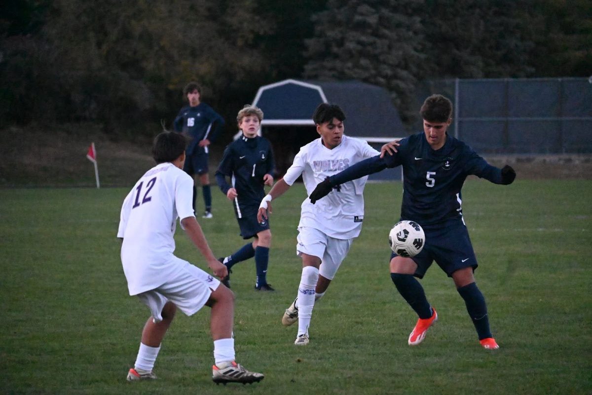 PRESSING UP. Erik Bjorgvinsson (‘27) settles a ball with his knee as he pushes up into the attacking third.