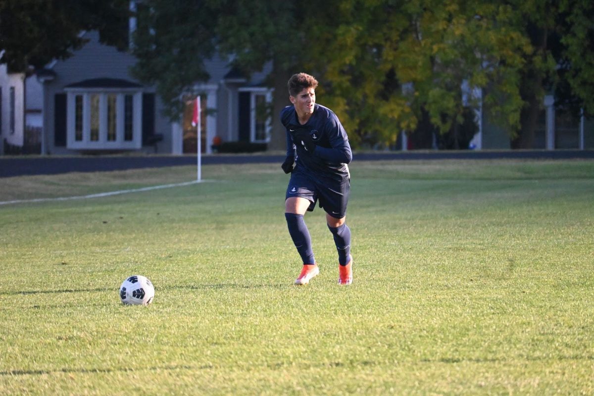 PRIME POSITION. Sophomore Erik Bjorgvinsson (‘27) lines up for a free kick and lifts his head to survey the situation. The Spartans had most of their first-half chances come as results of set pieces, but only a few were able to find attackers in a scoring position, and those shots were either blocked or trickled just wide of the net.