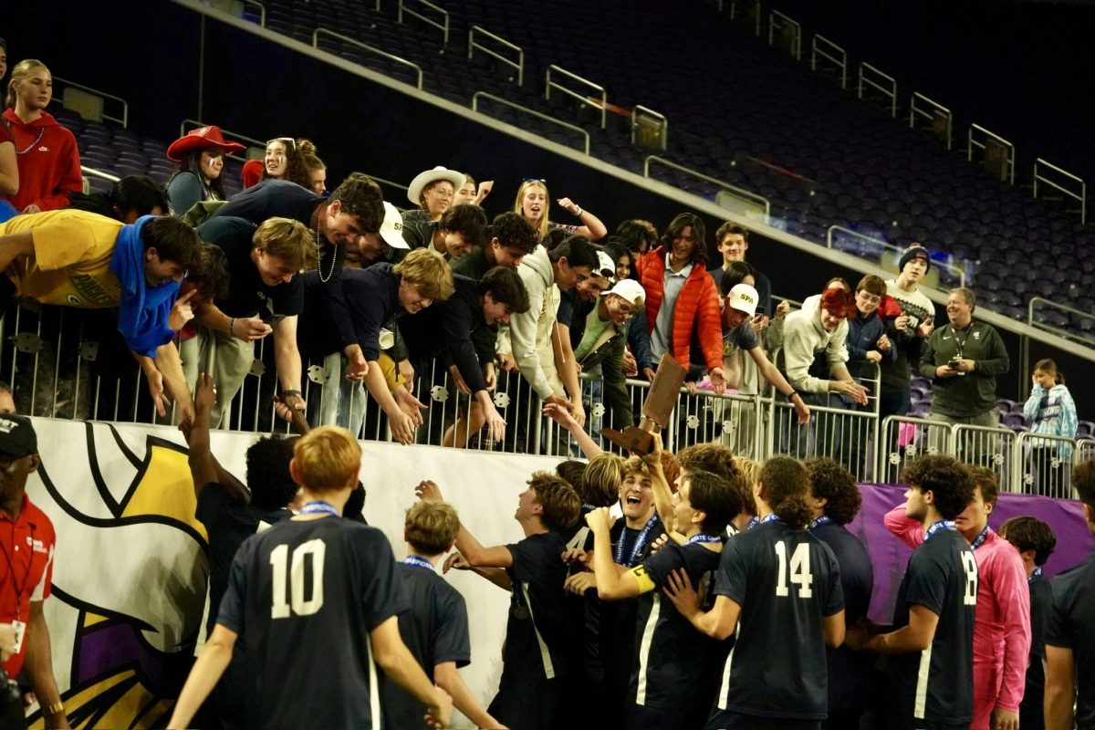 CELEBRATE AS ONE. The Spartan student section congratulates and celebrate with the state champs.