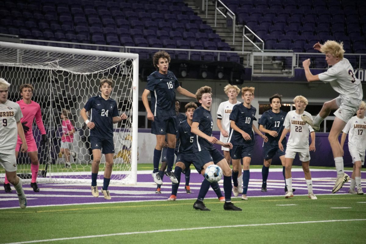 EYES OUT. The boys team turn their heads to the ball after a Lourdes header. 