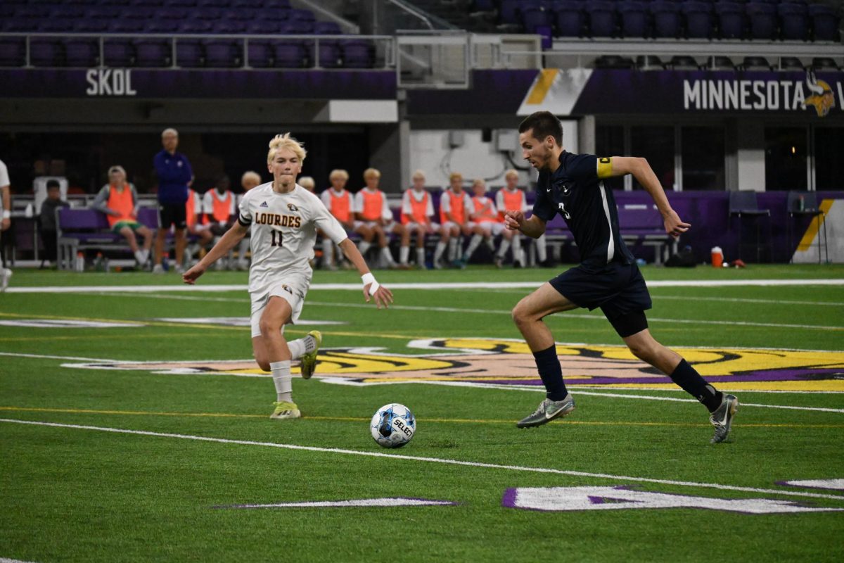 SPEEDY STRIDES. After receiving the ball, captain Liam Sullivan races across the field toward the net. Sullivan is BVS's leading scorer, racking up an impressive twelve goals and three assists in his final season playing for SPA.