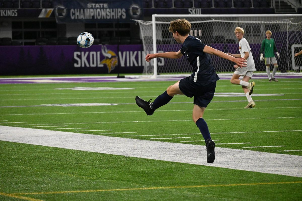 LUCKY LEFT. Senior Rowan McLean sends the ball up the field to his teammate. McLean played a pivotal role for BVS in the state tournament; he scored the game tying goal in the quarterfinal, and he was selected for Class A's All-Tournament Team. 