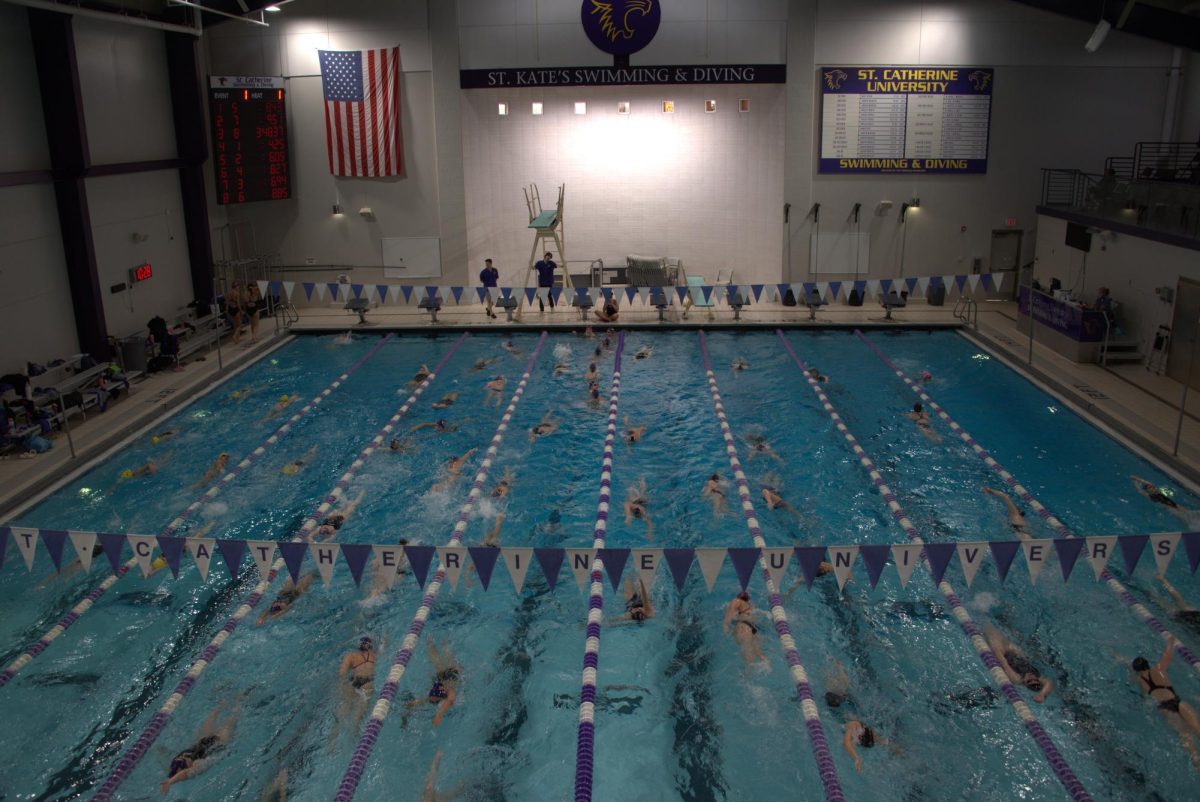 PRE-SWIM. Competitors swim warm-ups with their teams.