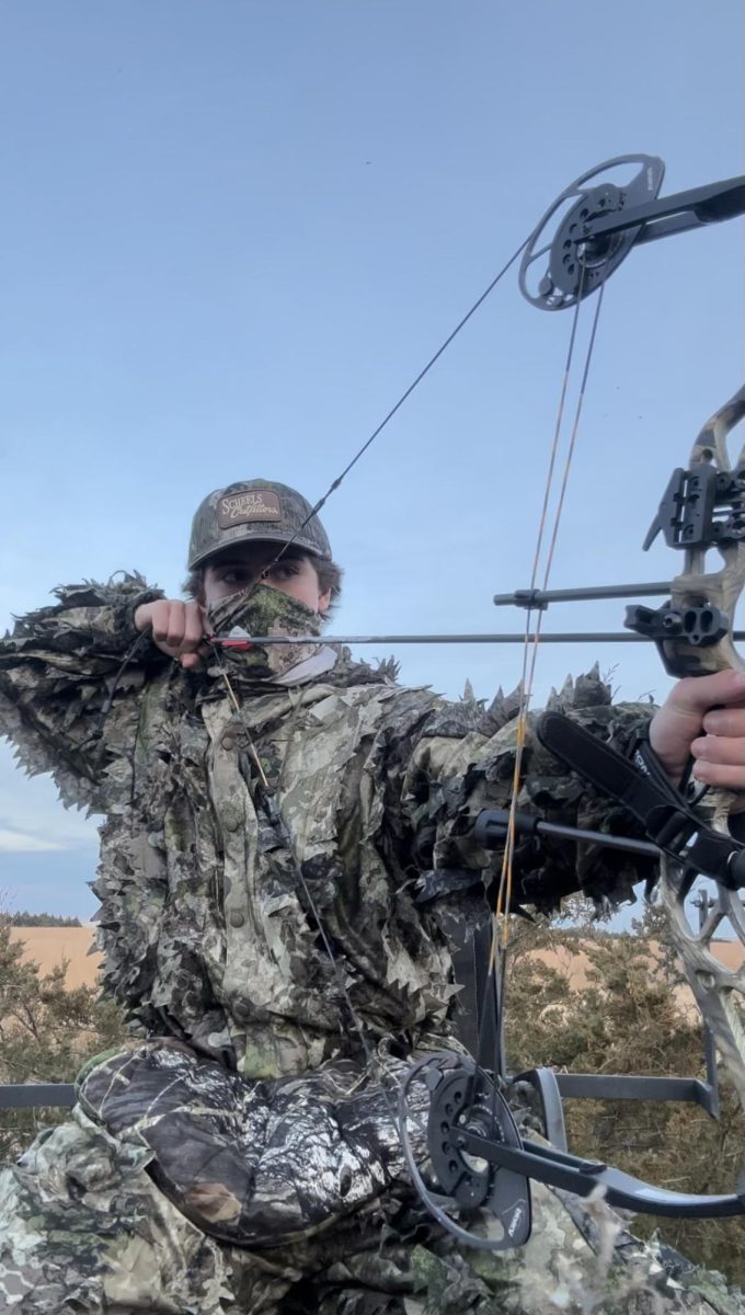 READY AIM FIRE. Sophomore Charlie Zakaib draws his bow back, getting ready to shoot (Submitted by Charlie Zakaib)