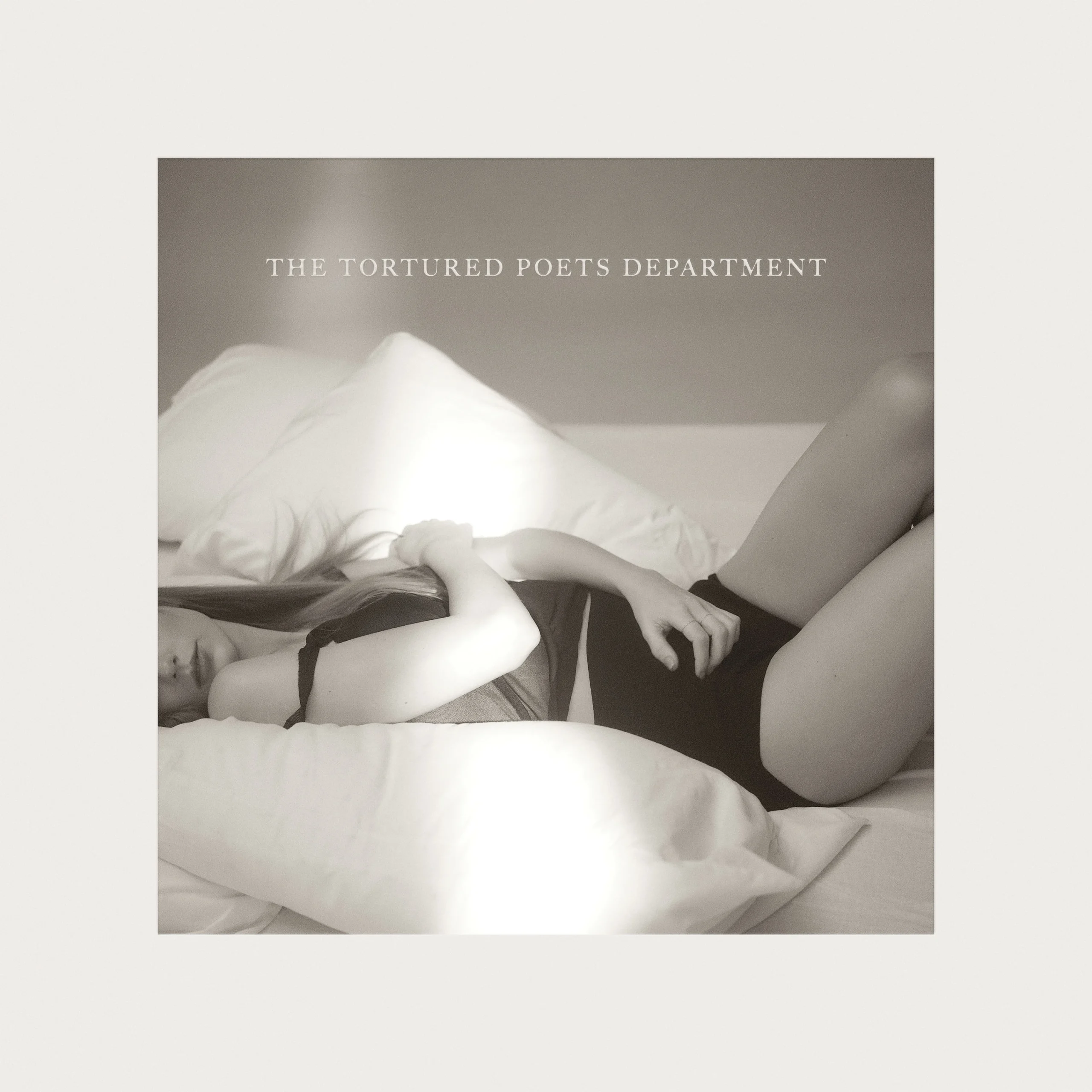 BLACK AND WHITE. The cover for "The Tortured Poets Department" was part of a larger photoshoot, with many of the photos being used for deluxe album releases (Album cover photographed by Beth Garrabant, released by Republic Records)