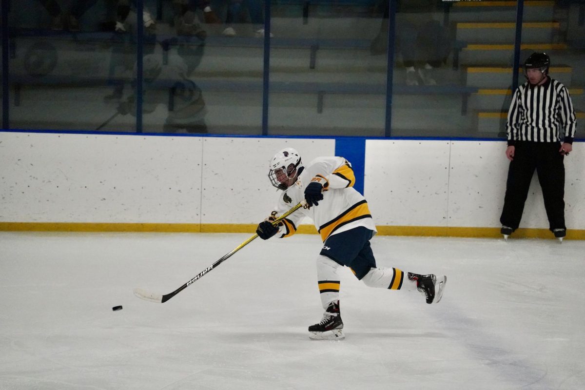 TAKING A SHOT. Senior defensemen Peter Hoppe takes a shot just past the blue line. 