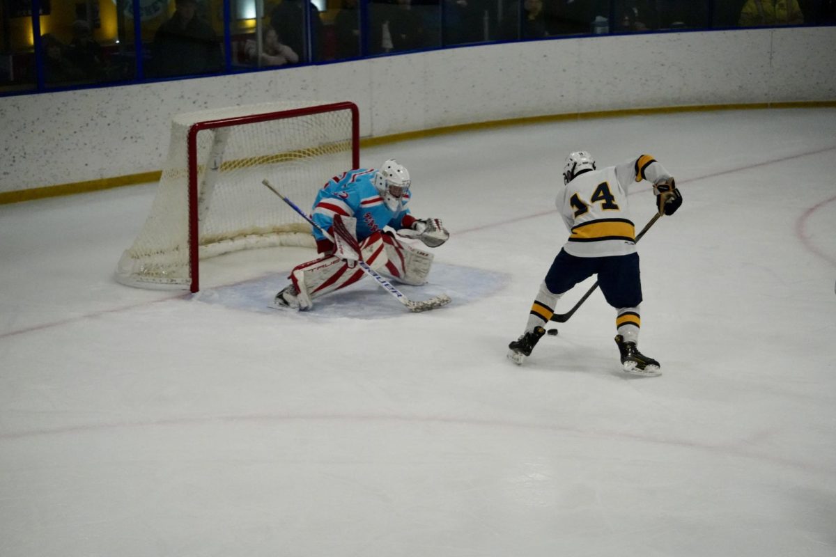 ONE ON ONE. Forward senior Liam Huddleston faces up against the goalie with no other players around to help.