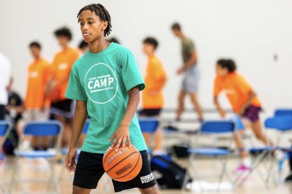 FOCUS. Ninth grader Magarsaa Mullatta swiftly dribbles the ball between his legs while focusing on what his next move will be. (photo submitted by Magarsaa Mullatta)