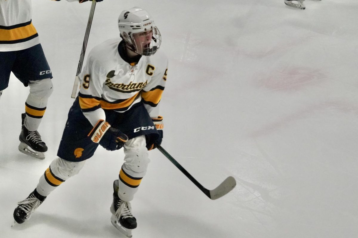 POST GOAL THRILL. Forward senior Ethan Peltier yells out of excitement as he gets the first goal of the game. 