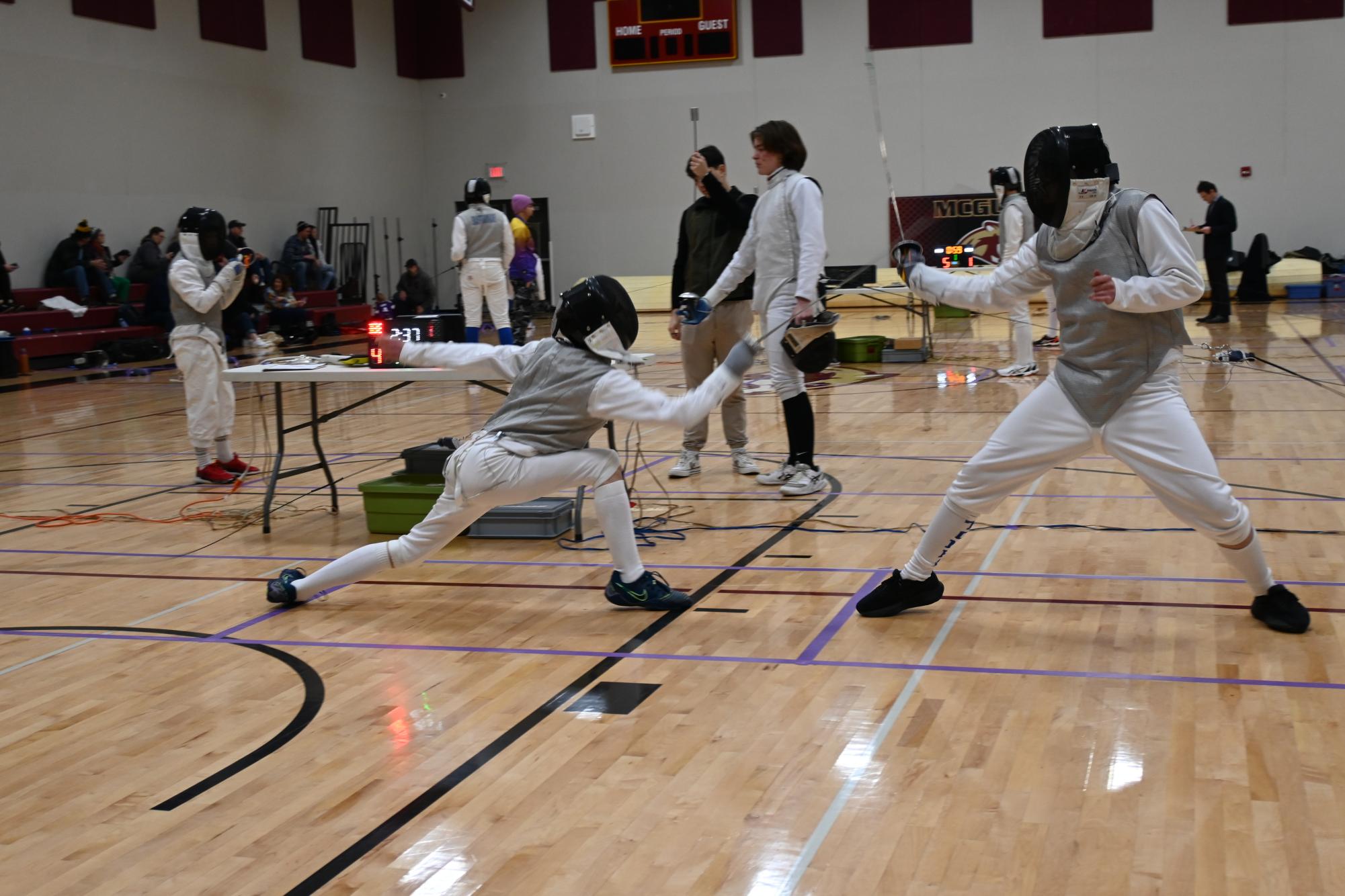 LUNGES: Zack Berchenko lunges forward for the hit to score a point. Zack used this strategy to advance out of his pool.