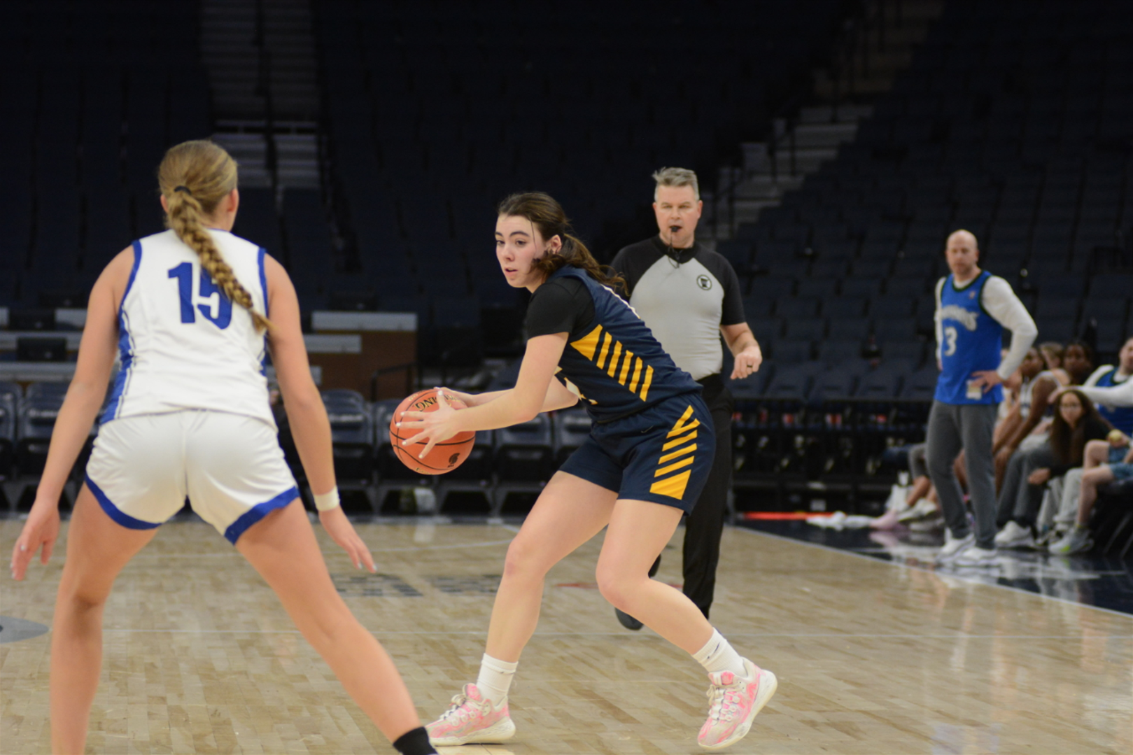 ON THE OFFENSE. Junior Clare Ryan Bradley scans for the court for a passing opportunity. 