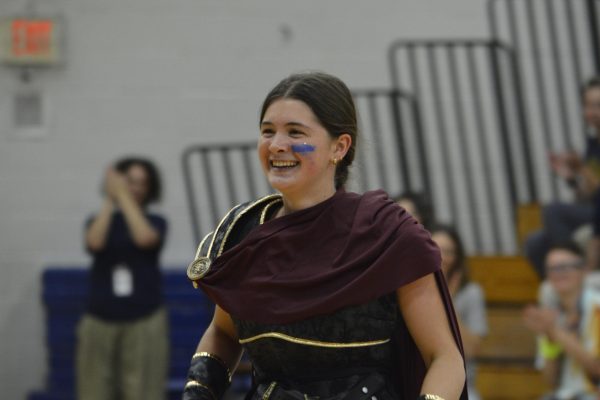 SENIOR SPARTAN. Senior Cassandra Overholt leads the annual homecoming pep rally dressed as the Spartan. She has valued the independence becoming a senior has given her. 