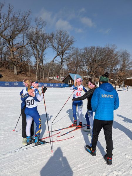 CONGRATS. Senior Inga Wing and Junior Maren Overgaard are congratulated after they finish their race. Photo submitted by Maren Overgaard. 